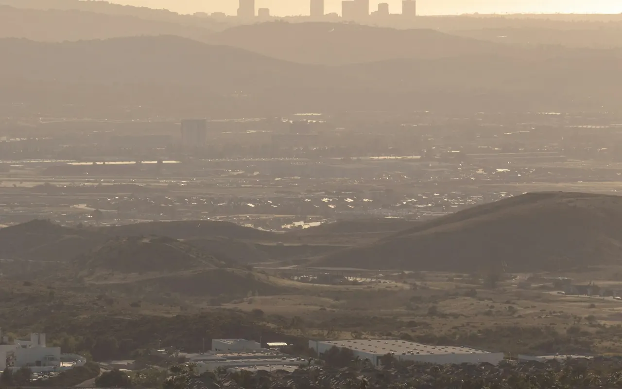 Orange County cityscape viewed from a hill at golden hour